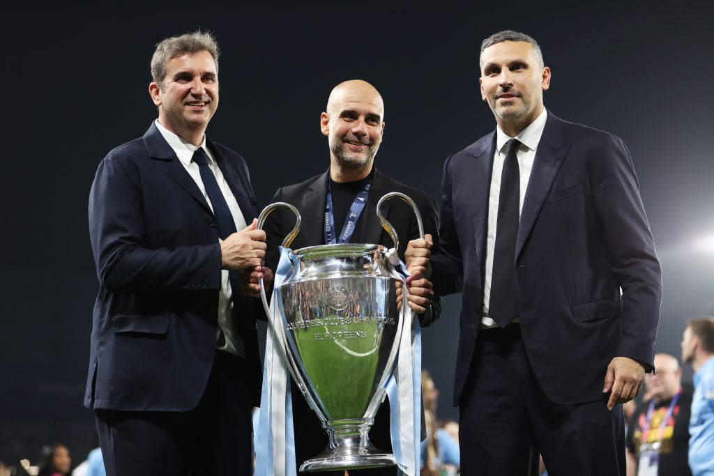 Ferran Soriano, Pep Guardiola and Khaldoon Al Mubarak, Chairman of Manchester City, celebrate the club's first Champions League