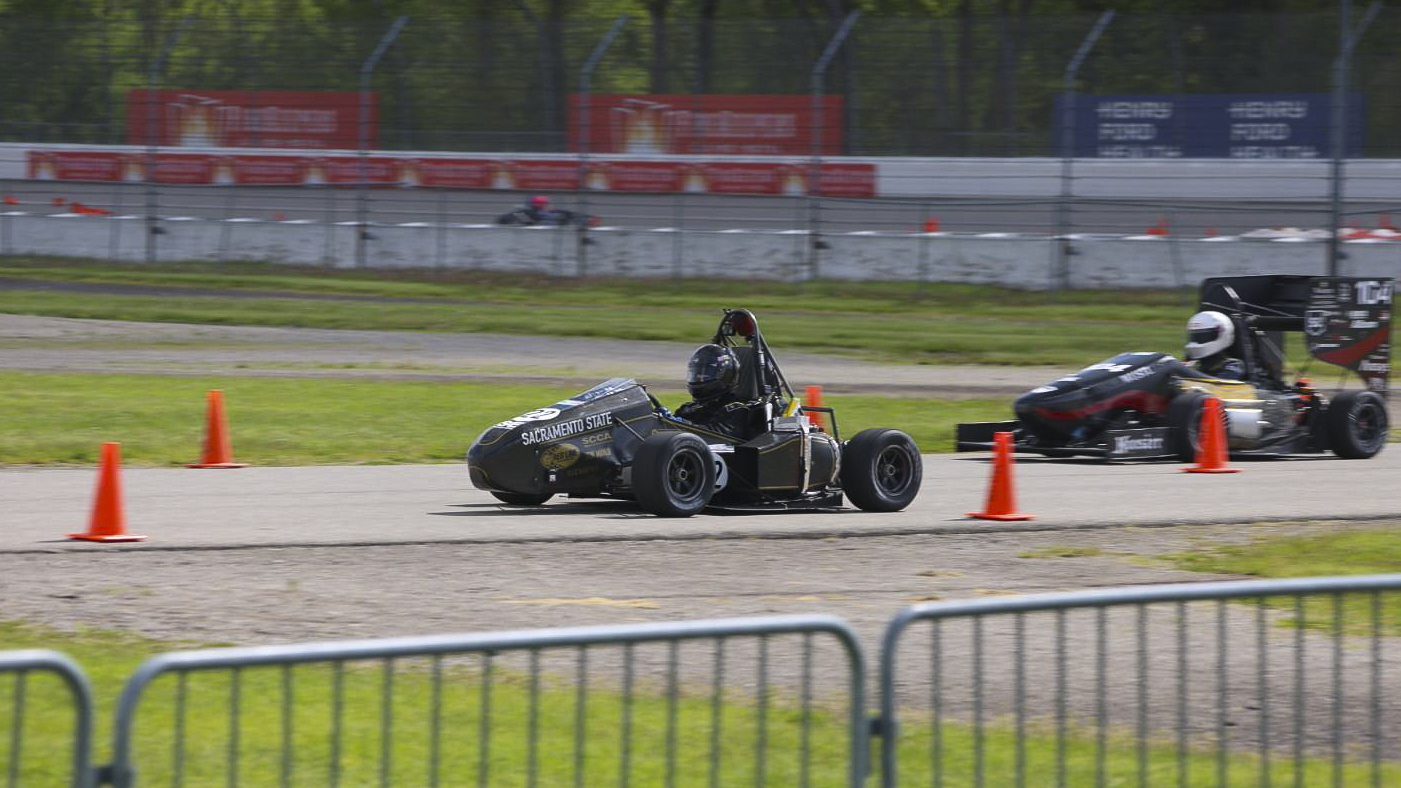 A racing car on a track during a competition.