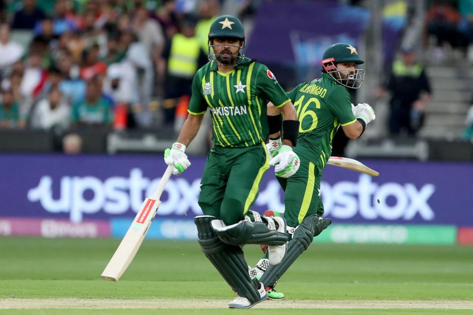 Pakistan's Muhammad Rizwan (right) and Babar Azam run between the wickets during the 2022 ICC Men's Twenty20 World Cup cricket final match between England and Pakistan at the Melbourne Cricket Ground on November 13, 2022.