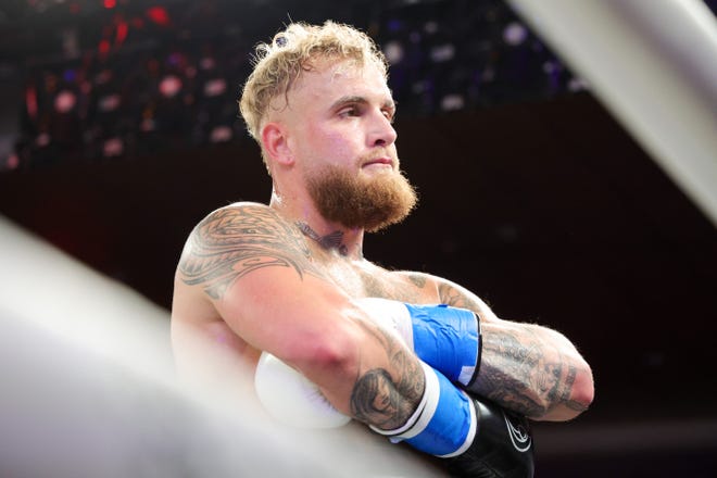 Jake Paul reacts after defeating Andre August in the first round at Caribe Royale Orlando.