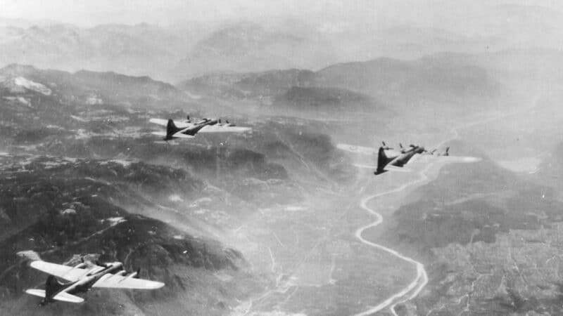 B17 airplane flying over the Alps